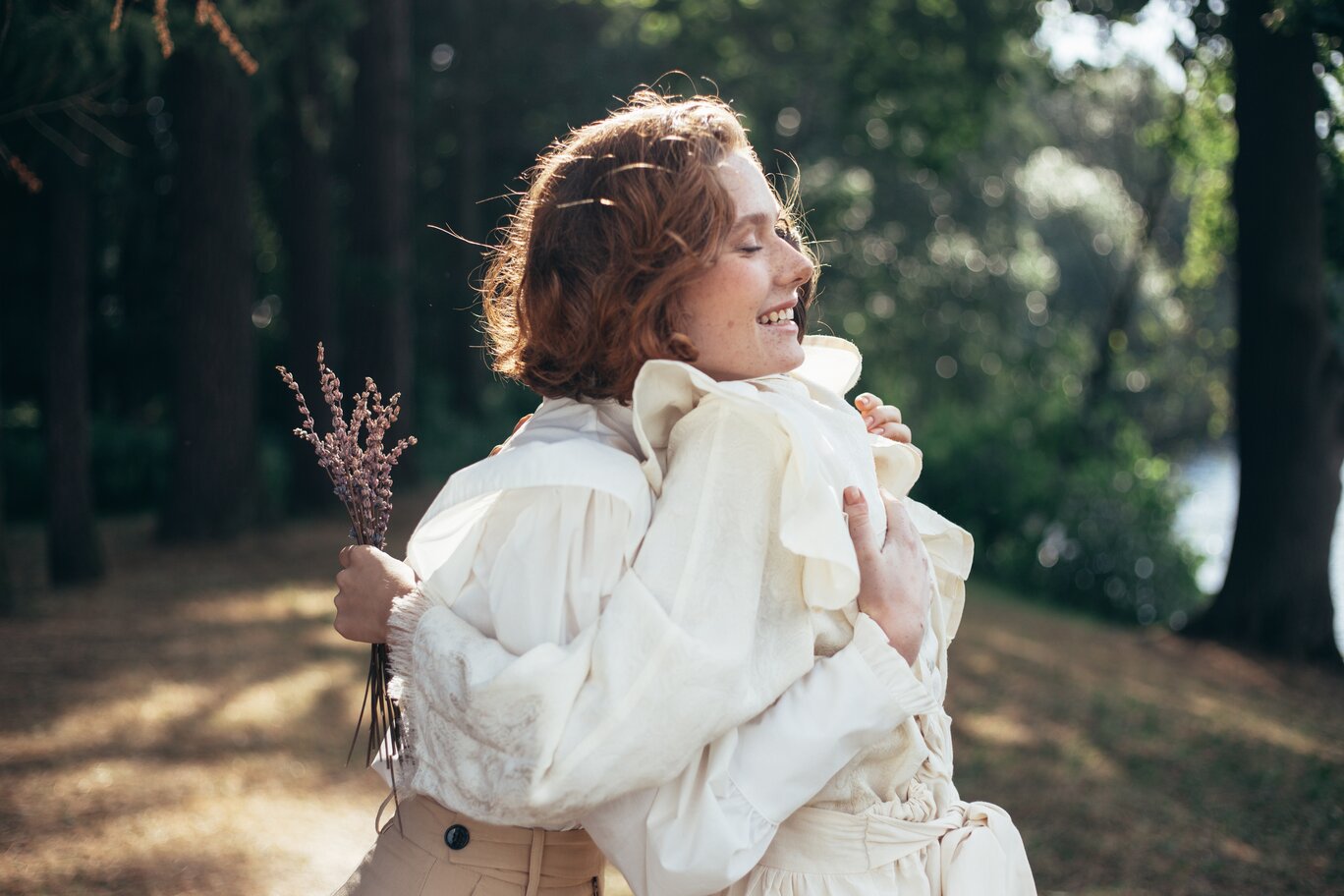 two girlfriends embracing each other relationship