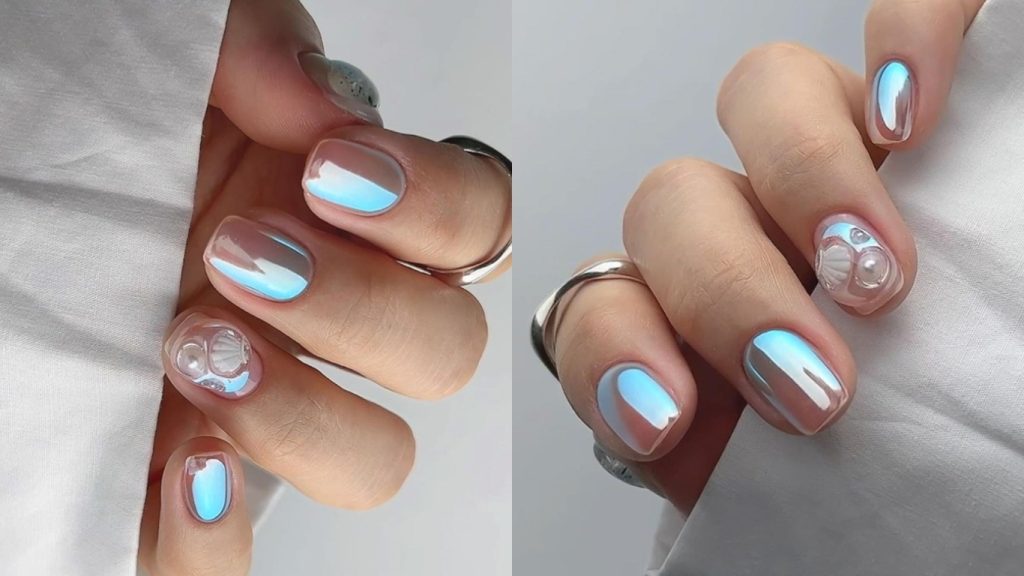 nail đẹp - bàn tay được son móng lấp lánh màu xanh và nude